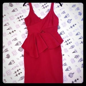 Bodycon red dress with flounce peplum and cutouts